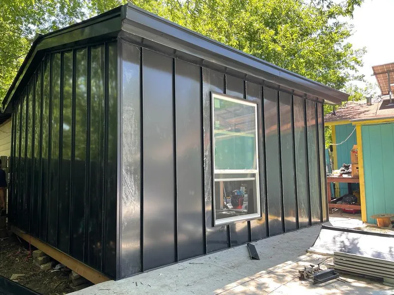 Black standing seam metal wall panels for Roof Inspection in Larkin