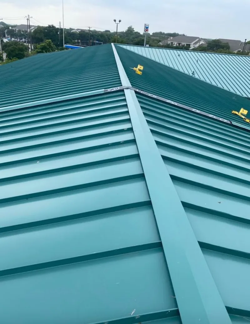 Green commercial metal roof ridge and valley for Metal Roof Repair in Larkin